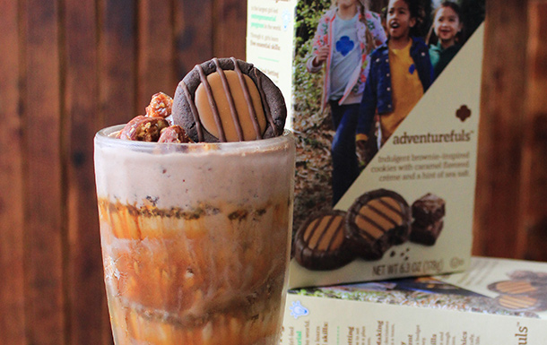 Girl Scout Campfire Adventure Milkshake next to a bok of Adventurefuls cookies.