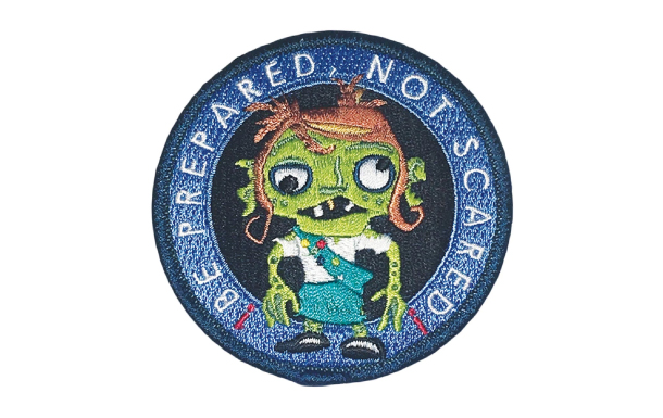 The Great Cascadia Zombie Survival Challenge patch features a zombie with white text circling the zombie that says "Be Prepared, Not Scared."