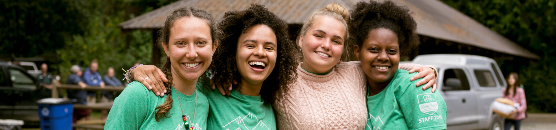  Four smiling Girl Scout camp staff. 