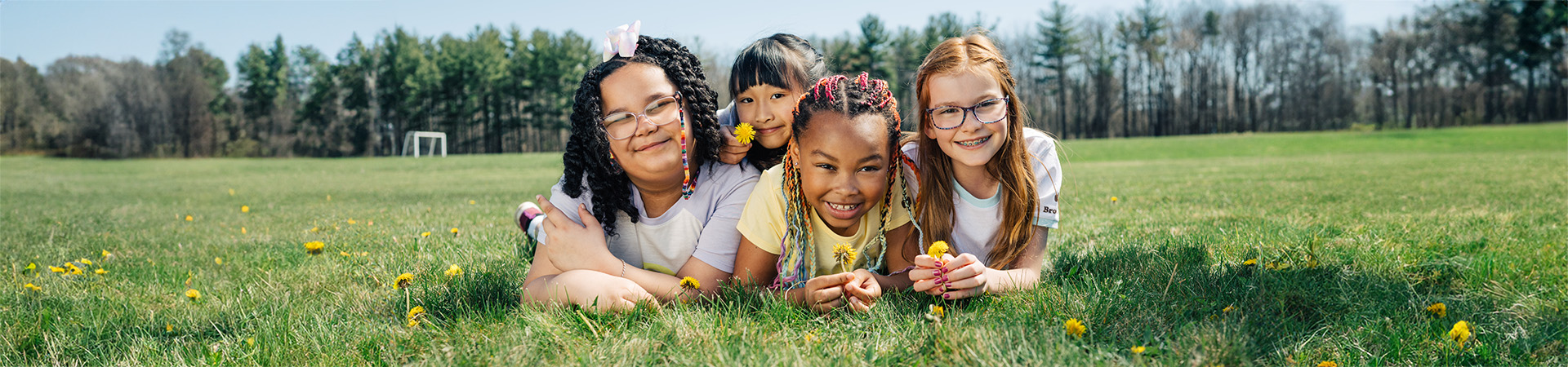  A close up of a khaki-colored Girl Scout vest decorated in a variety of colorful badges. 